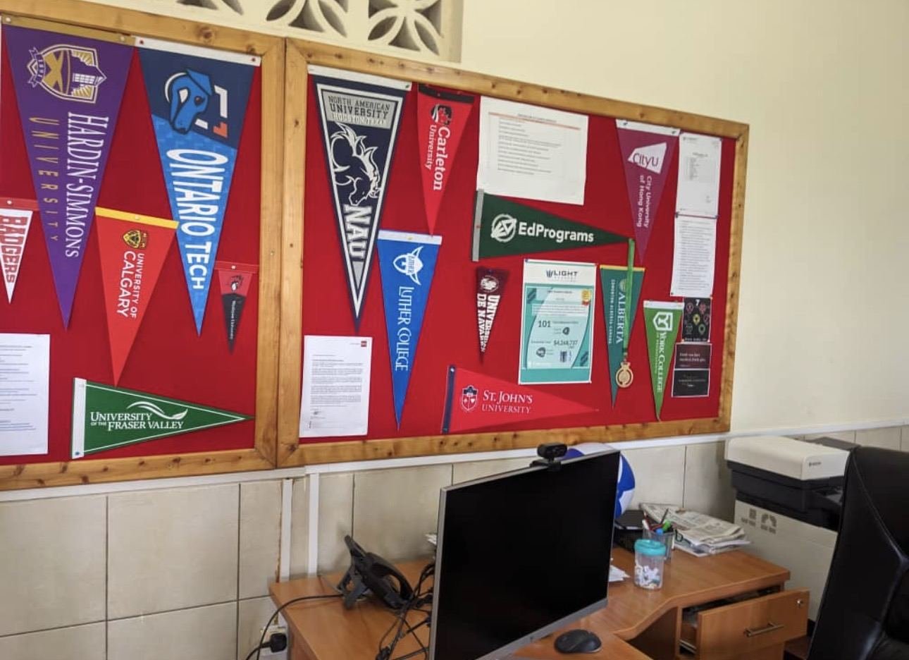 University pennants on our counselling office board